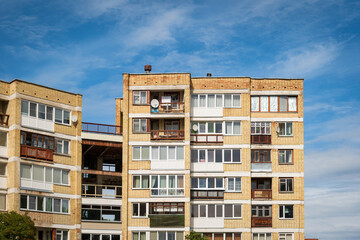 Bright brick apartments building with flat windows in visaginas lithuania