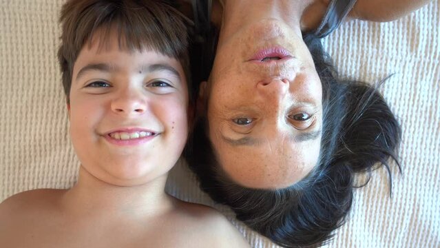 Fethiye, Turkey - 15th of September 2023: 4K Cute young son and his aging mother vice versa face to face 10 years
