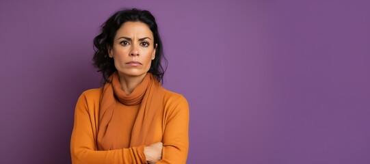 Serious Brunette Woman in Brown Outfit on Purple Background - obrazy, fototapety, plakaty