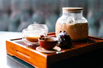 Raamstickers tea pot and Cup of masala tea © pavel siamionov