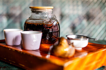 tea pot and Cup of puer tea on table