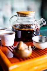 tea pot and Cup of puer tea on table