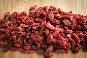Goji berries on a wooden background
