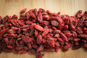 Goji berries on a wooden background