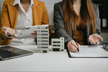 Real estate broker agent presenting and consult to customer to decision making sign insurance form...