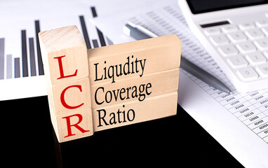 Word LCR- LIQUIDITY COVERAGE RATIO made with wood building blocks, business concept