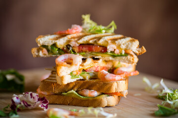 sandwich with lettuce and shrimp.