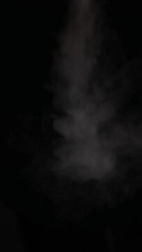 vertical video of smoke dark background 