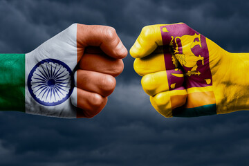 INDIA vs SRI LANKA confrontation, religious conflict. Men's fists with painted flags of INDIA AND...