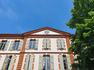Fototapeta premium low angle view of beautiful building against blue sky in Toulouse, France