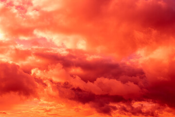 Fantastic surreal bright sky with clouds in red and pink colors