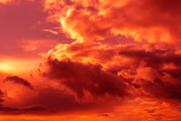 Obraz premium Fantastic surreal bright sky with clouds in red and pink colors