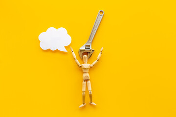 Head in pliers - headache and migraine concept. Wooden figurine of a man with pliers