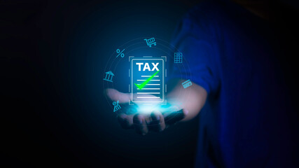 income tax. Businessman pointing to tax icon. income tax system icon around. pay online income tax. futuristic virtual screen interface technology.Money saving ideas in the age of virtual technology..
