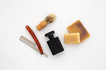 Black perfume bottle for man with shaving accessories