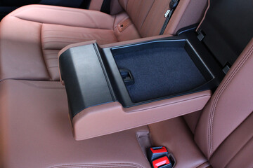 Electric car armrest rear passenger with open box. Electric Car inside. Premium electric car...