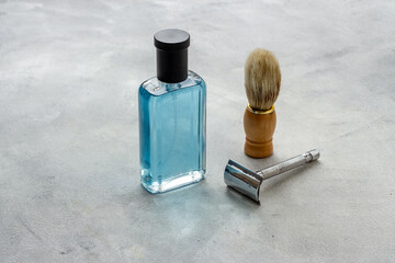 Men perfume and shaving tools. Male accessories close up