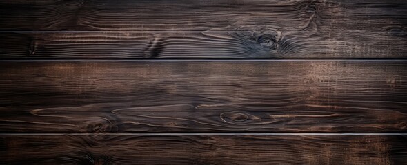 A textured dark wood background with a beautiful grain pattern
