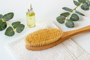 Spa massage body brush with cosmetic products and bath supplies