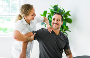 Modern rehabilitation physiotherapy woman with man client