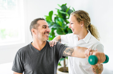 Modern rehabilitation physiotherapy woman with man client