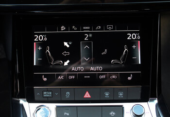 Touch panel climate control of an electric car. Electric car interior. Modern luxury car interior.