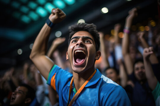 young man and excited audience celebrating and screaming while watching cricket match at stadium