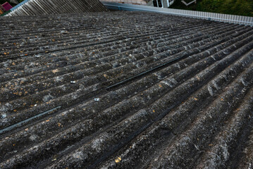 Close up of dirty asbestos cement roof sheets. - obrazy, fototapety, plakaty