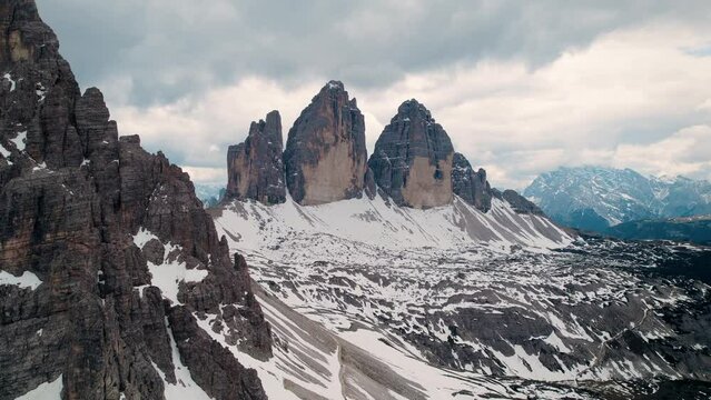 Drone footage of the three distinctive battlement-like peaks of the Tre Cime di Lavaredo, Italy