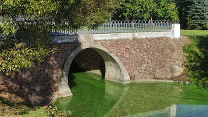 Minsk, Belarus – 09 26 2023: Old Bridge on Komsomolsky island on Svisloch river. Beautiful capital city view at Autumn day