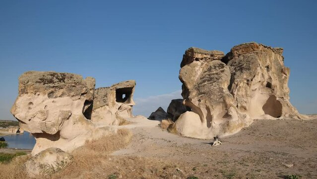 Phrygian valley. Forty Stairs Rock and Phrygian rock chambers by Lake Emre. Travel destinations in Turkey. Ihsaniye district, Afyonkarahisar. 4k video