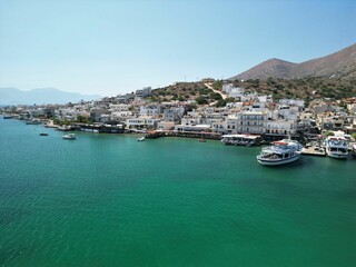 Fototapeta na wymiar Aerial view of the small town of Elounda Bay, located on the Greek island of Crete