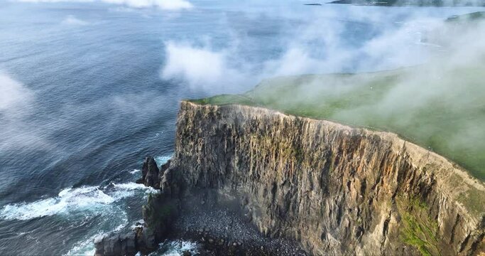 Flying over the clouds above the Cliffs of Moher 4k