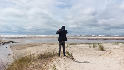 man walking on the beach