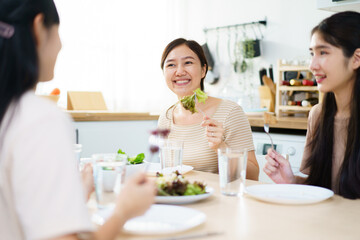 Happy Asian man and women enjoy having a launch together. Group of Asian people have a launch.