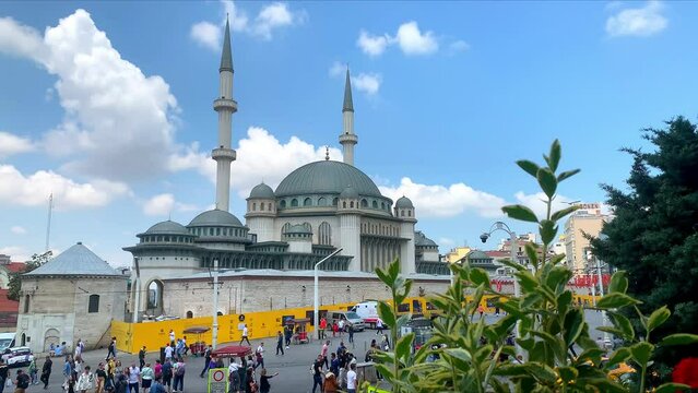 Istanbul, Turkey - Mai 15, 2023: Awesome view of the Taksim Mosque and the Republic Monument at the Taksim Square on sunny day. The public square is a popular tourist destination.