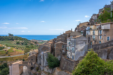 Fototapeta na wymiar Hillside town in Badalato Italy with the sea in the background on a clear day