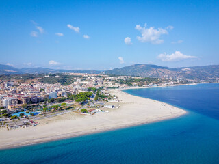 Soverato Italy drone shot of the coastline and the city with the mountains in the background
