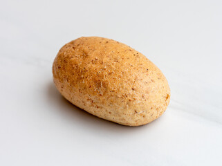 One roll (bread) on a board