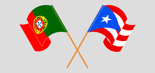 Crossed and waving flags of Portugal and Puerto Rico