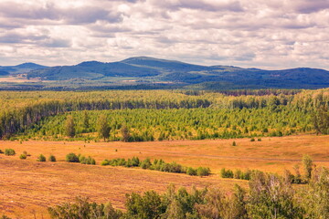 Fototapeta premium South Ural, Ural mountains in summer. Sunset in the mountains. The top of the mountain range. Summer day.