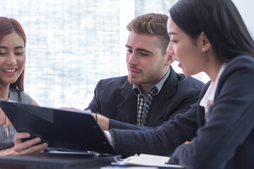 secretary present a document to boss to reading. coworker explain statistics, Hand finger point to...