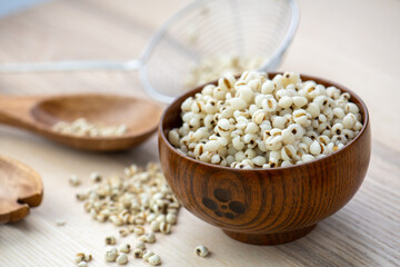 Hot Boiled Job’s Tears millet seed from boiler. White boiled Job’s Tears is highly nutritious cereal healthy fresh organic in salad dish.