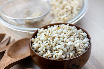 Hot Boiled Job’s Tears millet seed from boiler. White boiled Job’s Tears is highly nutritious cereal healthy fresh organic in salad dish.
