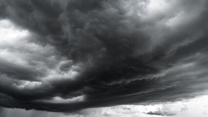 Obraz premium dark clouds make sky in black. Heavy rain thunderstorm . Pattern of clouds overcast predict tornado, Hurricane or thunderstorm and rainy.