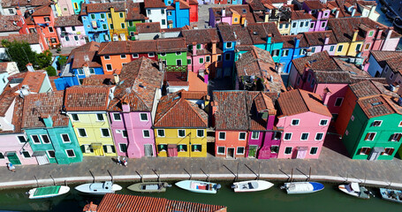 Vibrant facades of Burano, scenic canals and fishing town charm near Venice, Veneto, Italy