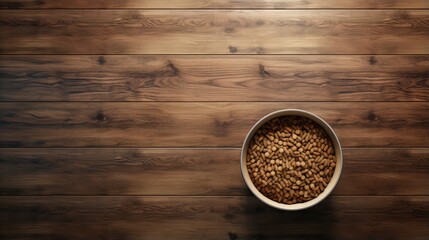 Top view of pet food in bowl on wooden table