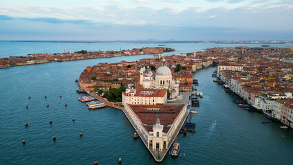 Venice Italy skyline, aerial view of Basilica di Santa Maria della Salute and Grand Canal at sunrise