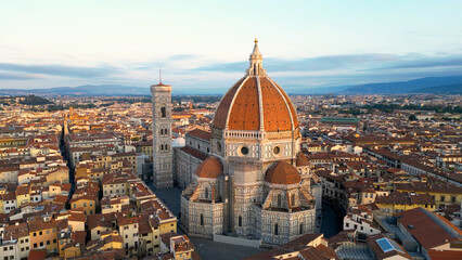 Fototapeta na wymiar Aerial view of Florence Cathedral (Duomo di Firenze), Cathedral of Saint Mary of the Flower, sunset golden hour, Italy