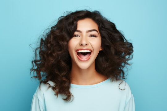 Happy ultra beauty girl, woman, who is smiling and laughing, wearing bright clothes. Bright solid background